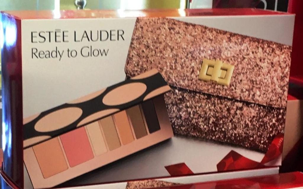 Estee Lauder 1. Metallic Evening Clutch Bag. 2. Bag free with Eyes and Cheeks Lip Palette, worth 40.00. 3.