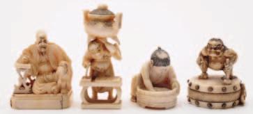 583 A group of four Japanese okimonos and netsuke comprising a netsuke of a seated man scooping a fish from a