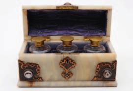 of rectangular outline, with scroll back, pen tray and single long drawer inlaid with mother of pearl, raised on gilt metal foliate decorated bracket feet, 22cm. wide.