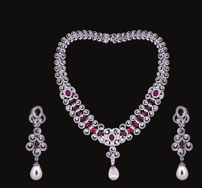 baguette diamond necklace has a pear-shaped ruby pendant enveloped by diamonds.