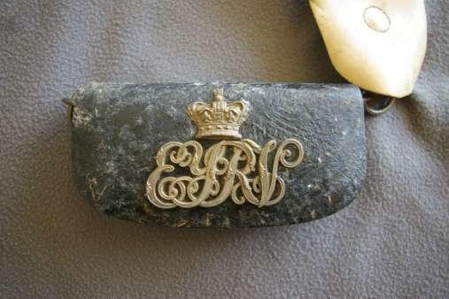 Attached to one end of the belt is a small black leather pouch bearing a Victoria Crown and the interwoven metal letters E.Y.R.V. for East York Rifle Volunteers.