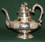 254 Four Piece Irish Silver Tea Service with embossed