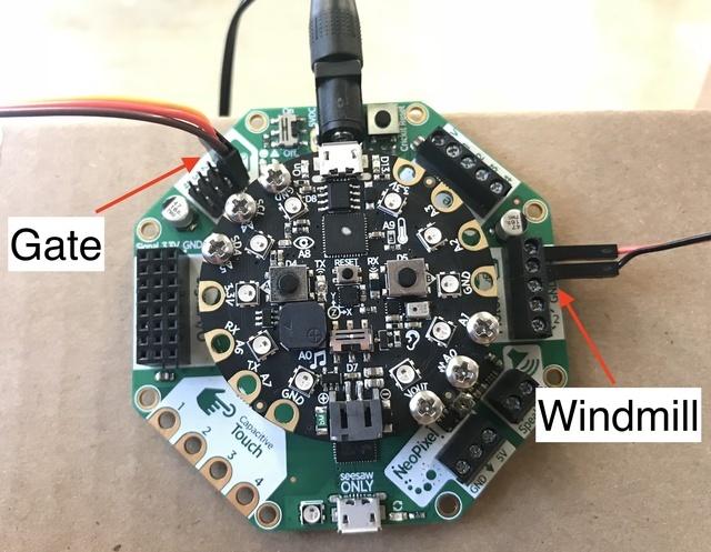 Connect to CRICKIT Once you've installed your obstacles on your course, connect them to CRICKIT as pictured. Connect the DC motor powering your windmill to CRICKIT's motor block in position 1.