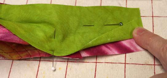 above the stitching line. Pin the band facing through all layers.