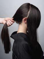 Remove the front hair in a clip in preparation to begin the braiding in the back.
