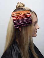 Move to your middle tone and, directly under the light foils, place your second color choice to begin to build up your under color