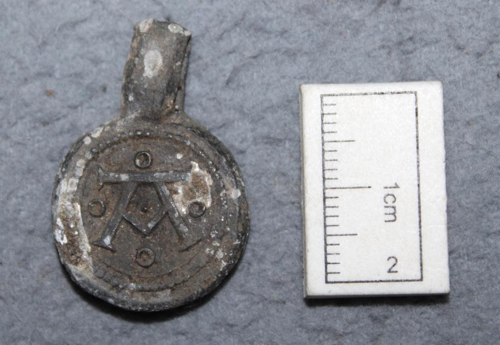 Fig. 18. An Early post medieval cloth seal made of lead. The A is the initial for the German town of Augsburg.