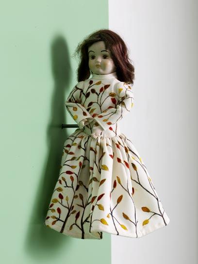 Untitled, 2008, (rotating doll with two upper bodies wearing a dress that will change colours in the rotation so that one side