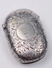 A Victorian oval vesta case with all over scroll and foliate decoration, the circular cartouche with coronet and T below for The Right Honourable Hardinge Stanley Giffard, Earl of Halsbury, Viscount