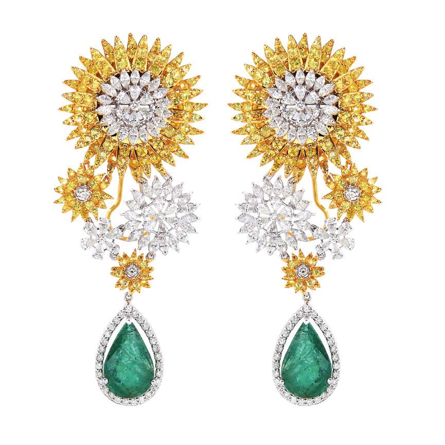 Cascading gold earrings set with diamonds and Gemfields Zambian emeralds.