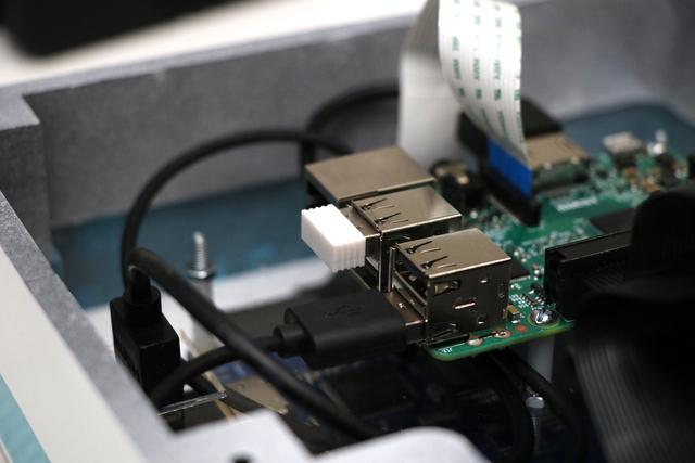 Plug the dongle for your usb mouse and keyboard into a usb port on the Pi.