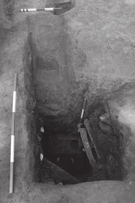 Figure 14. Photo looking down into the excavated section of the cellar. The entrance, with its posthole base can be seen as well as the edge of Feature 25.