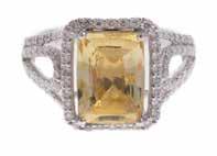 JEWELRY 237 238 A Lady s 390 ct Yellow Sapphire & Diamond Ring Platinum yellow sapphire and diamond ring featuring a cushion cut unheated yellow sapphire weighing 390 carats accompanied by a GIA