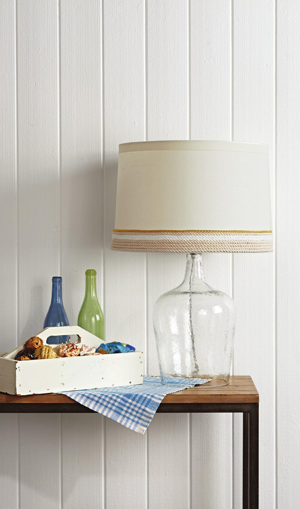 KNOW THE ROPES For a quick makeover with a nod to nautical style, wrap cord around the bottom edge of a plain lampshade.