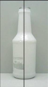 Figure 2 shows the printed film that has been reapplied to the bottle following a tape adhesion test after steam shrinking.
