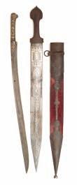 encased with brass panels, and fitted with a pair of ivory grips carved with deities on each side; a Caucasian dagger, 19th century, with curved double-edged blade formed with a medial ridge and