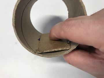 Cut another small rectangle of cardboard and bend this