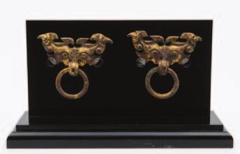 with loose rings hung from taotie masks, probably Han Dynasty, 7 x 5 cm on perspex display board.