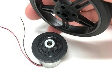 The wheel centers itself conveniently on top of the CD/DVD motor.