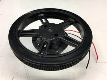 Use hot glue to connect the wheel to the top of the motor.