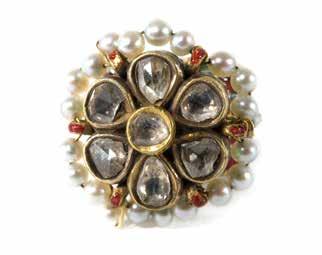 26 27 Ring North India, Rajasthan, Bikaner, 19 th century Gold ring, kundan set with seven polka, rose cut diamonds to form a rosette bordered with pearls, the band is decorated with multi colored