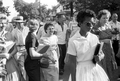 Attend class September 4, 1957, Elizabeth Eckford one of nine black students attempting to attend Central High School, in Little Rock, Arkansas is met with jeers and turned back by National Guard