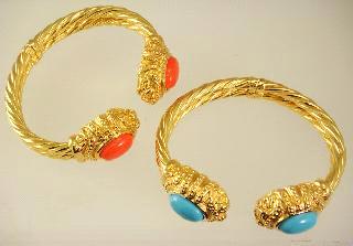 $125 - $175 Lot # 462 463 Lot # 464 464 465 14k yellow gold turquoise and coral mounted bracelets. $1,500 - $2,000 14k yellow diamond and pink sapphire ring.