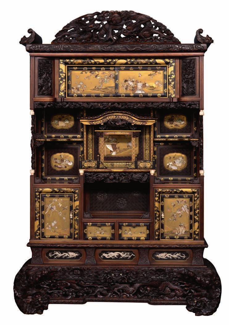 110 LOT 491 A rare richly carved Meiji period Japanese cabinet, decorated with mother of pearl, ivory and gilt lacquer on a black