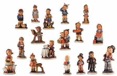 boy and girl figurines, one of which a special edition of Het Volk, 1948-1971, H 12-25 -