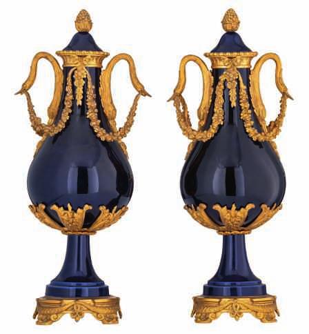 LOT 616 An impressive pair of blue royal and gold decorated vases and covers, in the