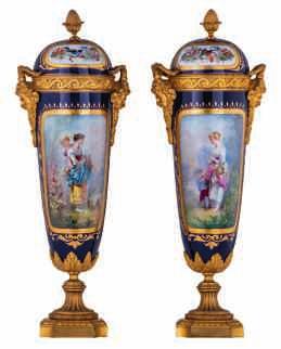 1500-2000 138 LOT 615 A pair of French blue royale glazed baluster shaped vases in the