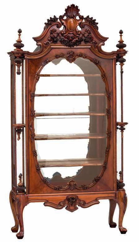 154 LOT 686 A very fine late Dutch Biedermeier walnut and mahogany display cabinet with sculpted decoration, produced by the famous