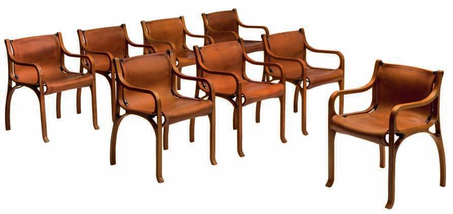 LOT 688 A set of eight armchairs by Cristian Valdes, Chair B, leather, steel tubing and laminated wood, part of the Exposición Universal de