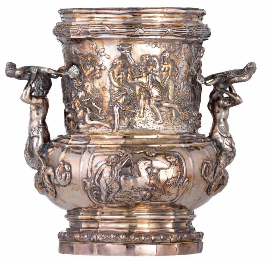 161 LOT 718 A silver wine cooler, relief decorated with cartouches depicting Neptunus, bacchanal scenes and mermaid shaped