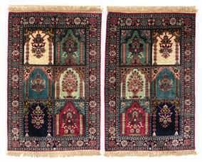 LOT 782 An Oriental silk carpet, decorated with figures