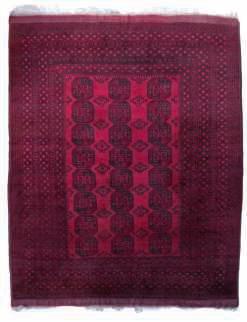 An Oriental woollen rug, 196 x 336
