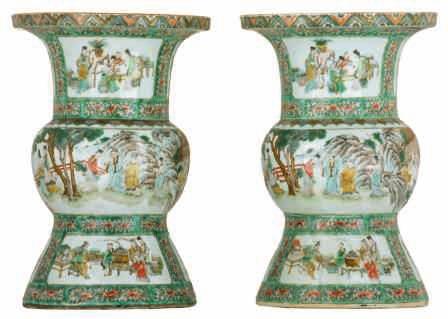 A pair of Japanese polychrome and relief decorated vases