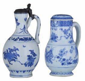 LOT 238 A Japanese Arita blue and white tankard, decorated with scrollwork and panels, filled