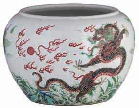 branches and calligraphic texts; added a Chinese blue and white vase decorated with a village in a