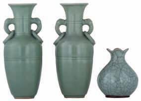LOT 363 A pair of Chinese celadon stoneware candlesticks, relief