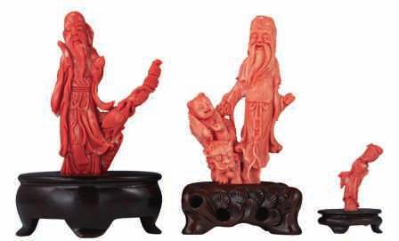 500-800 LOT 418 A fine red coral sculpture, depicting Tsai Shen Yeh, the God of Wealth, on a matching hardwooden base, H 21,8 (without base) - 23,8 cm (with base) Added expertise report according to