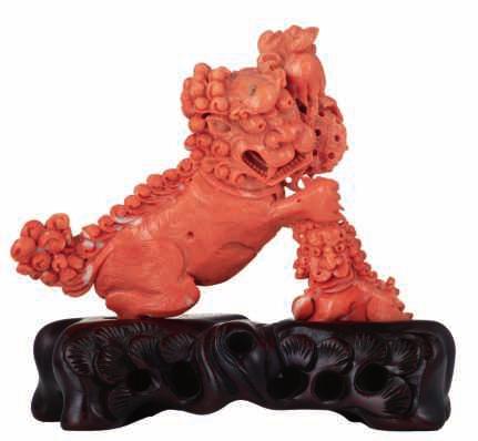 500-800 95 LOT 419 A finely carved piece of red coral, depicting the God of Wealth on a matching wooden base, H 13,9 (without base) - 16 cm (with base) - total weight of the coral 425  LOT 420 A lot