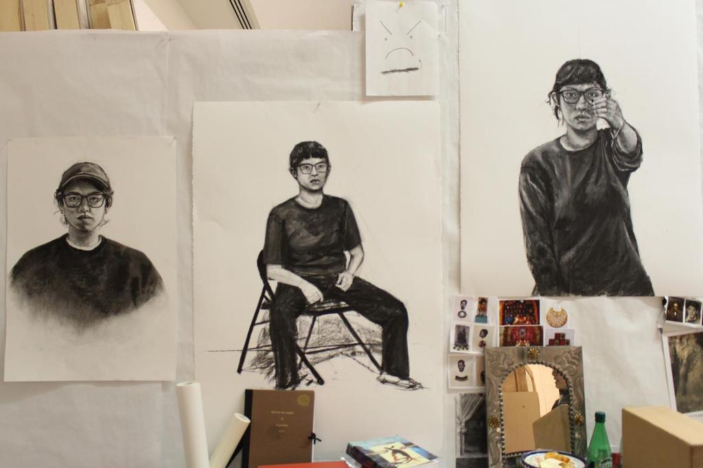 Mardueño 5 Figure 1 Photograph of studio space with charcoal self-portraits.