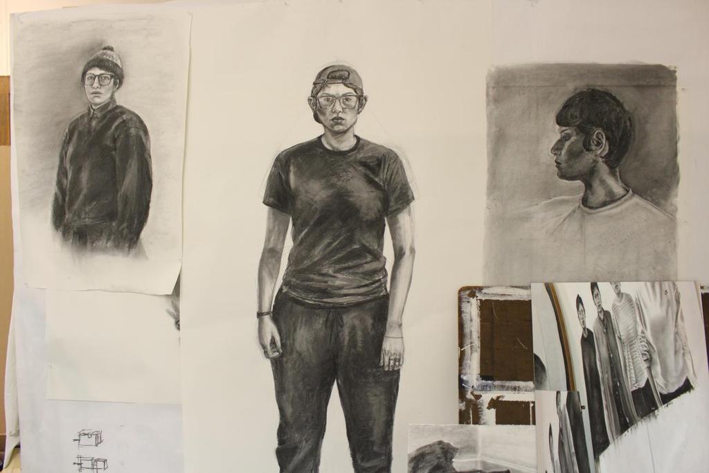Mardueño 6 Figure 2 Photograph of studio space with charcoal self-portraits -- I occasionally stare at myself in the mirror and wonder who that person is.