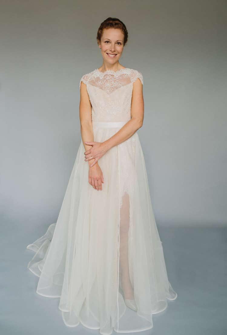 The removable silk organza overskirt has lace appliqués on the