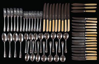 * 350-450 240 An Elizabeth II silver part rat tail pattern flatware service, maker Garrard & Co London, 1979 crested, includes, four tablespoons, six