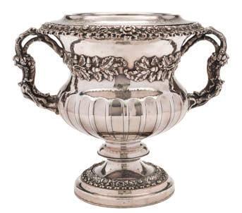 158 A 19th century silver plated twin handled wine cooler crested, with fluted body having bands of acorns and oak leaf decoration, on a knopped