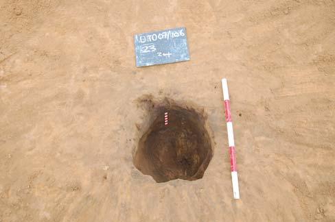 Plate 1: cremation urn pit 23 after excavation,