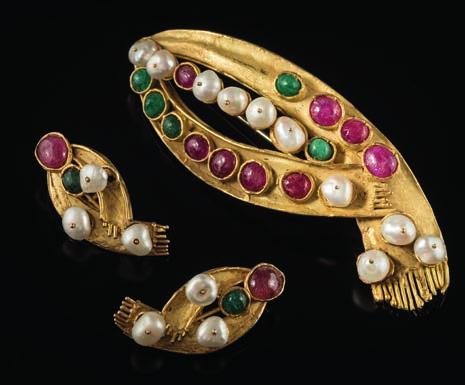 416 An emerald, ruby and baroque pearl mounted brooch with matching earrings of stylized scarf design, with baroque pearls (untested), cabochon emeralds and rubies,