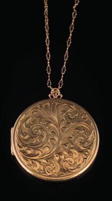 454 A 9ct gold circular, foliate design locket on chain, 22gms